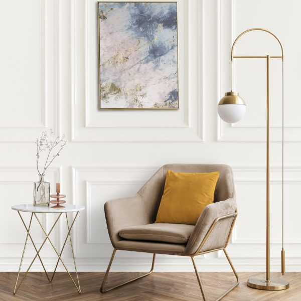 Picture frame by a velvet armchair Picture frame by a velvet armchair